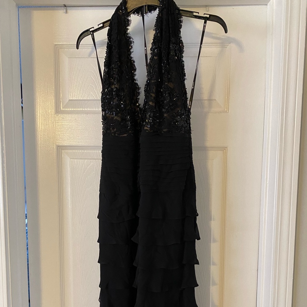 Black formal ruffled dress, worn once size 12 fits more like 8. No alterations